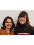 Head and shoulders photos of Dr Romola Sanyal and Lucy Earle smiling